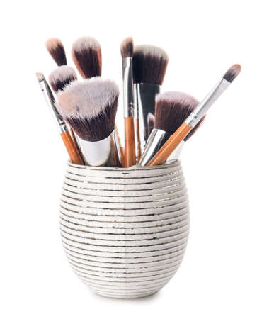 Holder with set of makeup brushes on white backgroundの写真素材