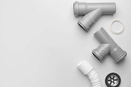 Set of plumber's items on light backgroundの写真素材