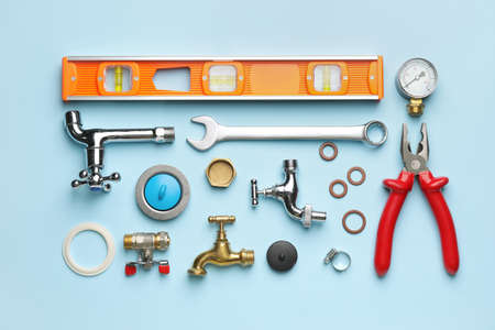 Set of plumber's items on color backgroundの写真素材