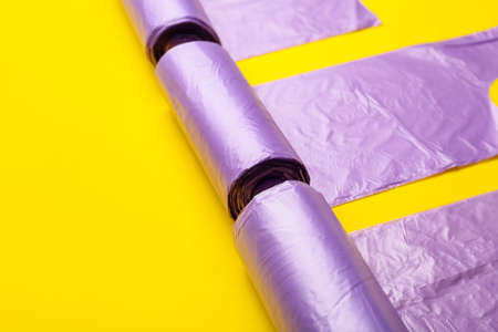 Rolls of garbage bags on color backgroundの写真素材