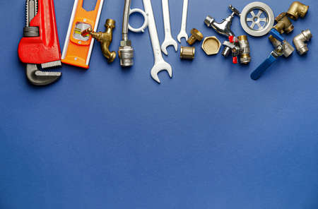 Set of plumber's items on color backgroundの写真素材
