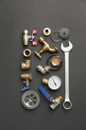 Set of plumber's items on dark backgroundの写真素材