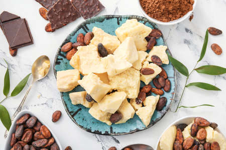 Composition with cocoa butter on light backgroundの写真素材