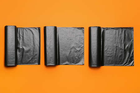 Rolls of garbage bags on color backgroundの写真素材