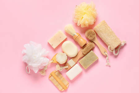 Composition with massage brushes and bath supplies on color background