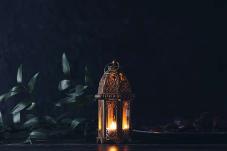 Muslim lamp and dates on dark backgroundの写真素材