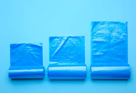 Rolls of garbage bags on color backgroundの写真素材