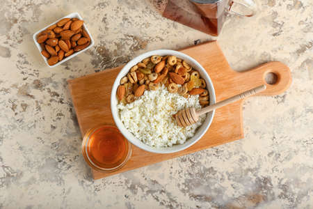 Bowl of cottage cheese on light backgroundの写真素材