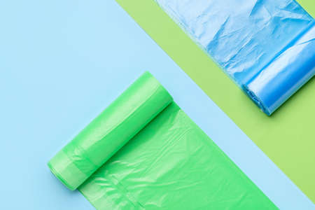 Rolls of garbage bags on color backgroundの写真素材