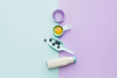 Ingredients for preparing bakery and kitchen utensils on color background