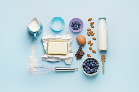Ingredients for preparing bakery and kitchen utensils on color backgroundの写真素材