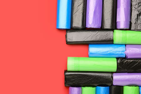 Rolls of garbage bags on color backgroundの写真素材