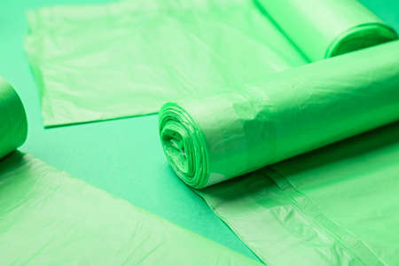 Rolls of garbage bags on color backgroundの写真素材
