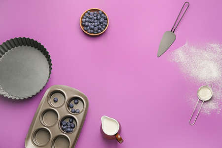 Frame made of ingredients for preparing bakery and utensils on color backgroundの写真素材