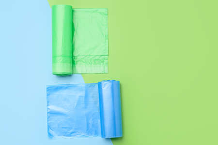Rolls of garbage bags on color backgroundの写真素材