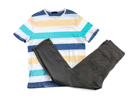 Stylish t-shirt and trousers on white backgroundの写真素材