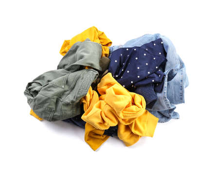 Heap of different clothes on white backgroundの写真素材