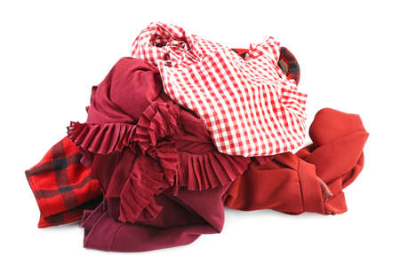 Heap of different clothes on white backgroundの写真素材