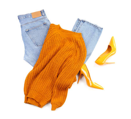 Female jeans, sweater and shoes on white backgroundの写真素材