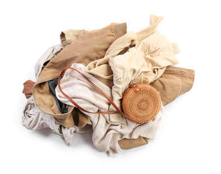Heap of different clothes on white backgroundの写真素材
