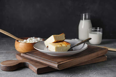 Plate with pieces of cottage cheese casserole on tableの写真素材