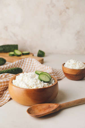 Bowls with cottage cheese on light backgroundの写真素材