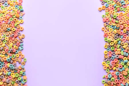 Crunchy corn flakes rings on color backgroundの写真素材