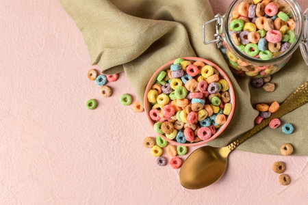 Crunchy corn flakes rings on color backgroundの写真素材
