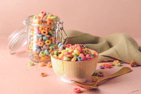 Crunchy corn flakes rings on color backgroundの写真素材