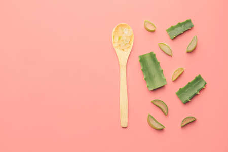 Spoon with fresh cut aloe on color backgroundの写真素材