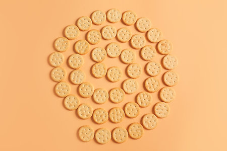 Tasty crackers on color background