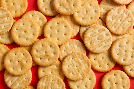 Tasty crackers on color backgroundの写真素材