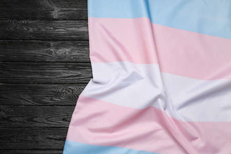 Transgender flag on dark wooden backgroundの写真素材