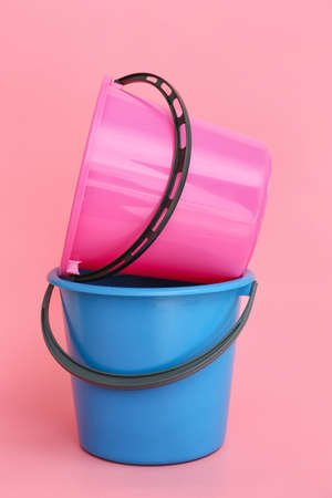 Plastic buckets on color backgroundの写真素材