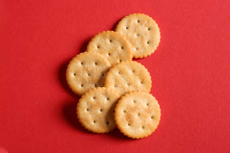Tasty crackers on color backgroundの写真素材