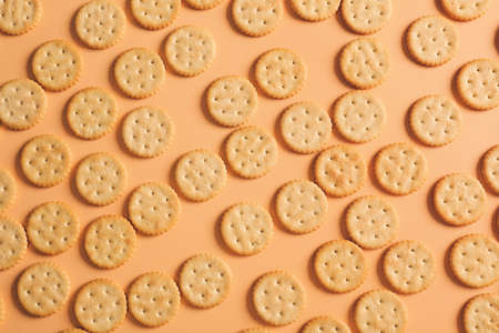 Tasty crackers on color backgroundの写真素材
