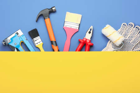 Set of tools on color background