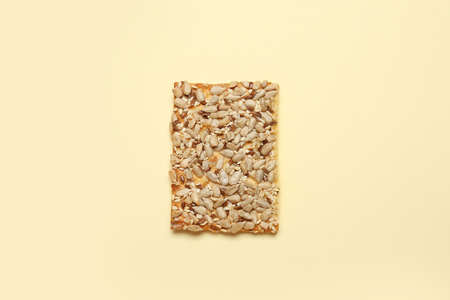 Tasty cracker with seeds on color backgroundの写真素材