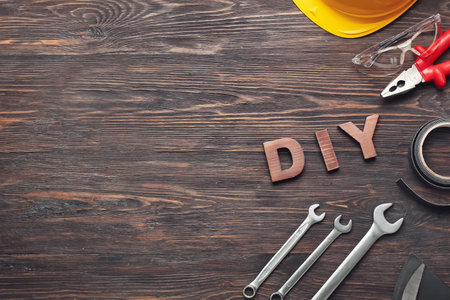 Set of tools and word DIY on wooden backgroundの写真素材