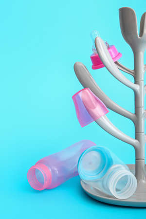 Drying rack for baby bottles on color backgroundの写真素材