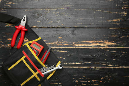 Set of tools on dark wooden backgroundの写真素材