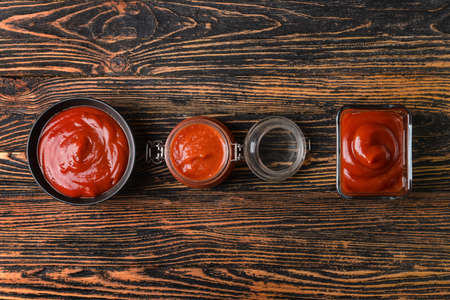 Organic tomato sauce on wooden backgroundの写真素材