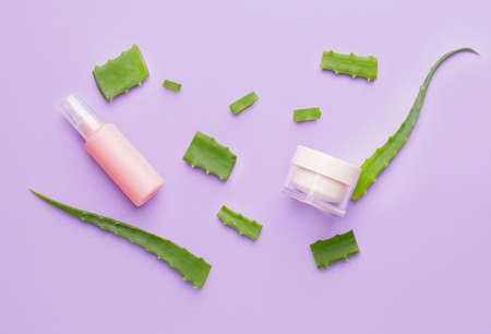 Different cosmetic products with aloe on color backgroundの写真素材