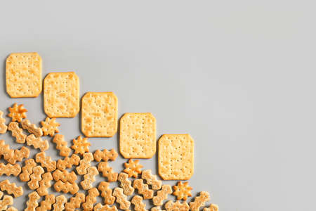 Tasty different crackers on light backgroundの写真素材