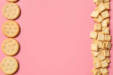 Tasty different crackers on color backgroundの写真素材