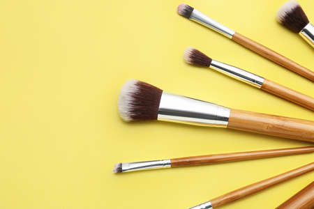 Set of makeup brushes on color backgroundの写真素材