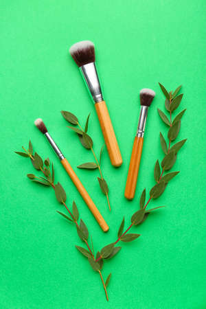 Composition with makeup brushes on color backgroundの写真素材