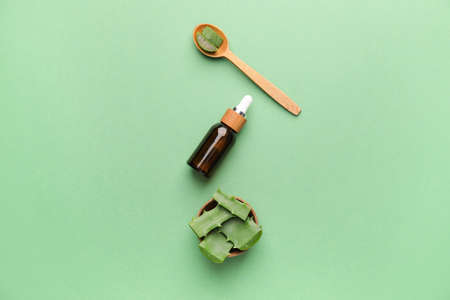 Cosmetic oil with aloe on color backgroundの写真素材