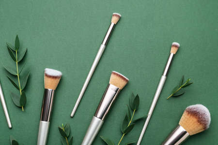 Composition with makeup brushes on color backgroundの写真素材