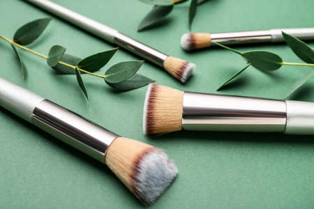 Composition with makeup brushes on color backgroundの写真素材